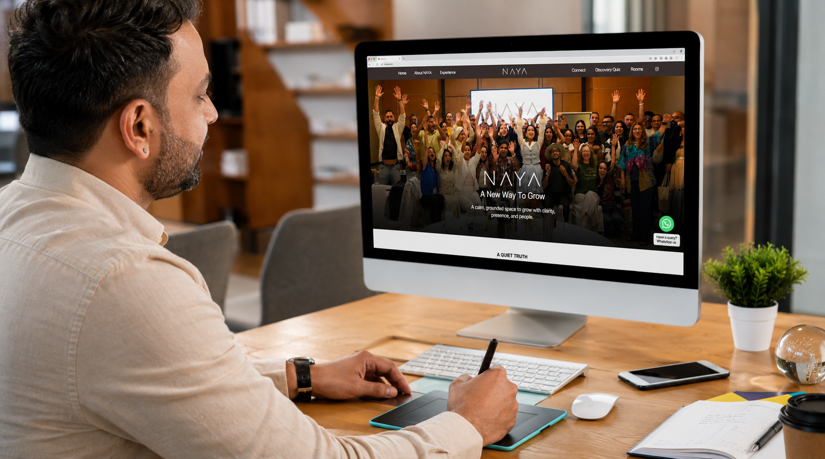 Designer reviewing a creative website project on screen